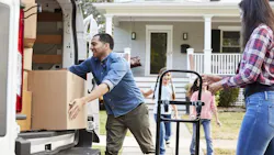 Movers moving boxes inside Movers moving boxes inside