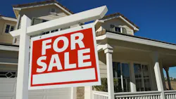 For Sale sign in a front yard For Sale sign in a front yard