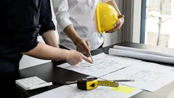 Builders going over house plans Builders going over house plans