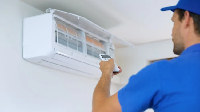 HVAC tech installing indoor unit