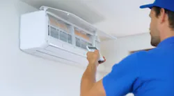 HVAC tech installing indoor unit HVAC tech installing indoor unit