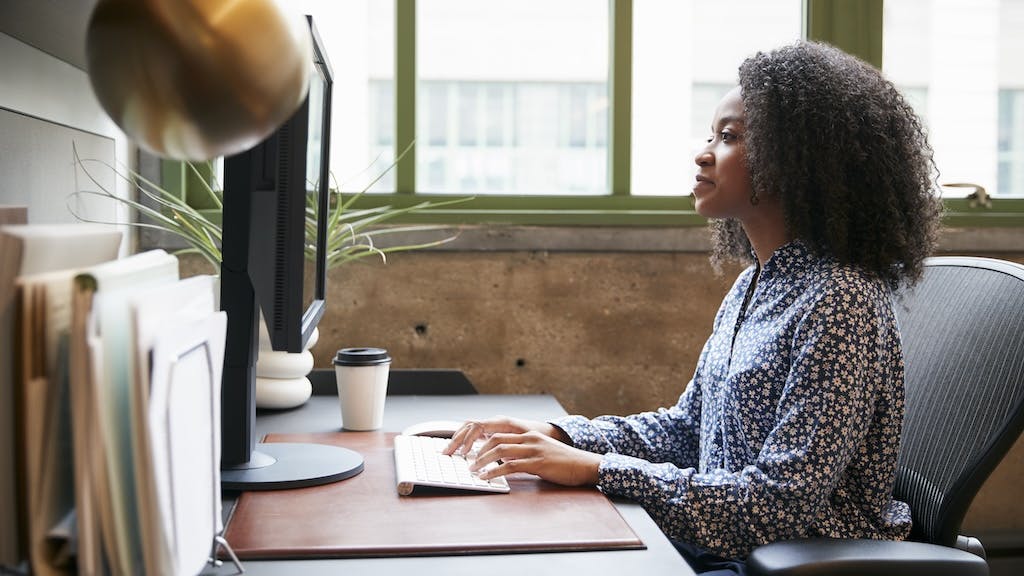 Housing professional working on a computer