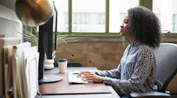 Housing professional working on a computer