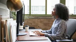 Housing professional working on a computer