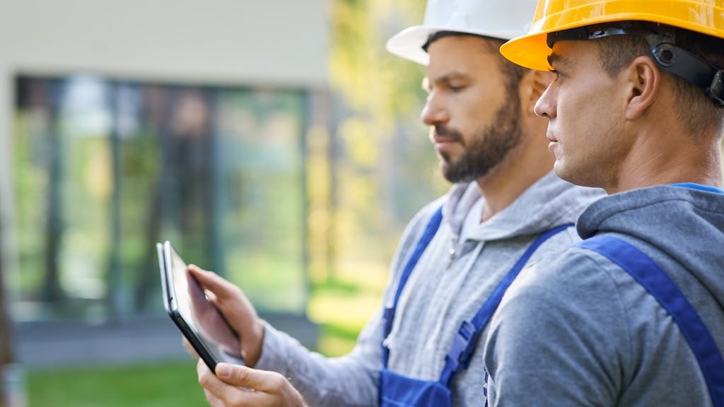 Two home builders collaborate on a project