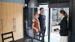 Gen Z couple touring a home with a real estate agent