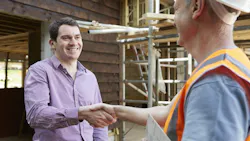 Builder shaking hands with a client