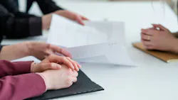 Businesses negotiating terms during a meeting