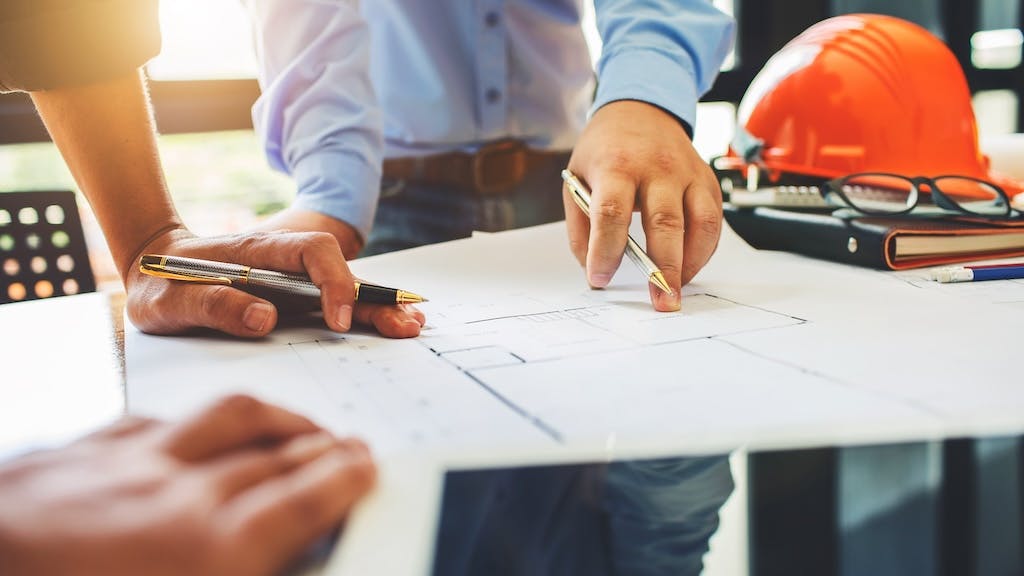 Builders working on a house plan together