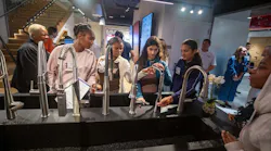 Girls explore the LIXL Experience Center during the Tools & Tiaras summer camp