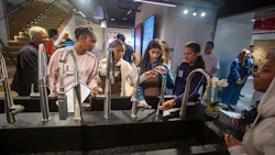 Girls explore the LIXL Experience Center during the Tools & Tiaras summer camp