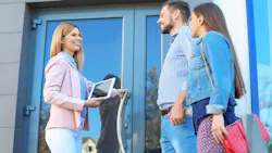 First-time buyers tour a home with a real estate agent