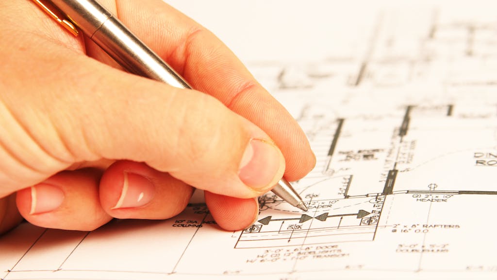 Architect drawing a floor plan