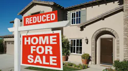 For sale sign in a front yard