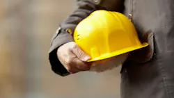 Home builder holding a hard hat