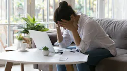 Homeowner looking stressed as she goes over her finances