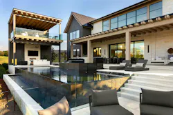 Patio 617 is an extension of a custom home in Tennessee, encompasing in door and outdoor living spaces on two levels (including a detached lounge and bar above) that open to an infinity-edge pool, a spa, and a fire pit.