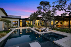 This outdoor living oasis in Texas successfully preserved and beautifully integrated existing trees to separate functions and avoind a 'newly built' feel.