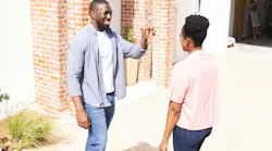 Excited homeowners holding up keys
