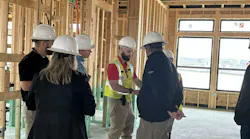 Clem Newcamp (in yellow vest) is the manager of field services and client success at IBACOS, a construction quality partner of several production home builders.