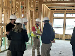 Clem Newcamp (in yellow vest) is the manager of field services and client success at IBACOS, a construction quality partner of several production home builders.