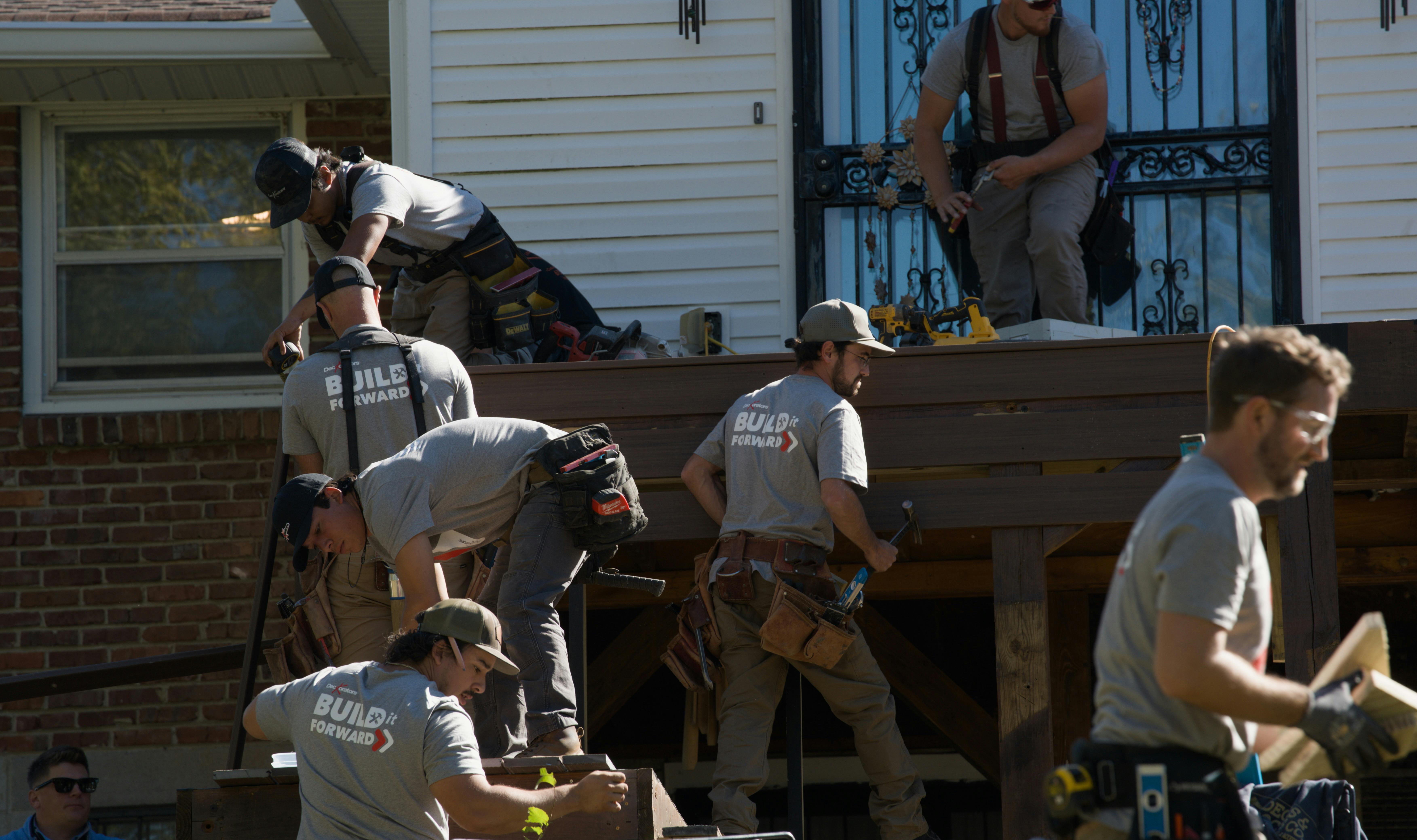 Deckorators certified pros work to construct a ramp during Build it Forward event in Nashville